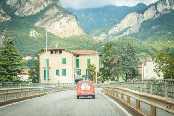 Just married couple on their wedding car. Italy