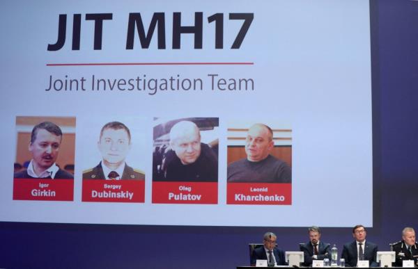 Russian natio<em></em>nals Igor Girkin, Sergey Dubinskiy and Oleg Pulatov, as well as Ukrainian Leo<em></em>nid Kharchenko, accused of downing of flight MH17, are shown on screen as internatio<em></em>nal investigators present their latest findings.