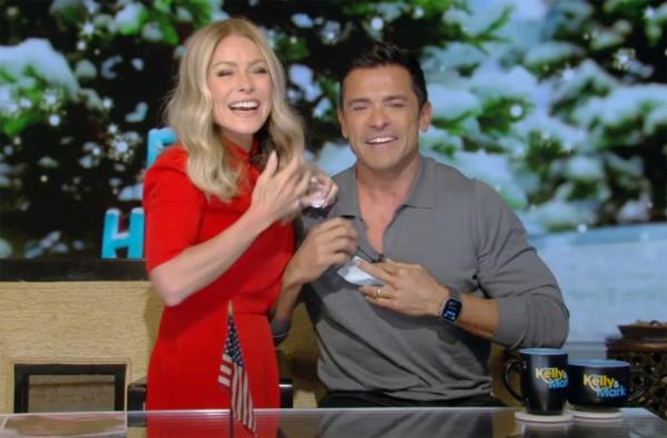 Kelly Ripa smiling with Mark Consuelos. 