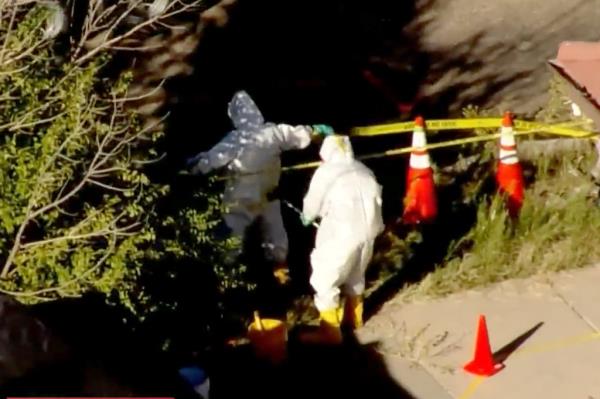 Authorities search the funeral home grounds.