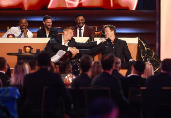 Tom Brady shakes hands with his old teammate Rob Gro<em></em>nkowski during the Netflix roast.