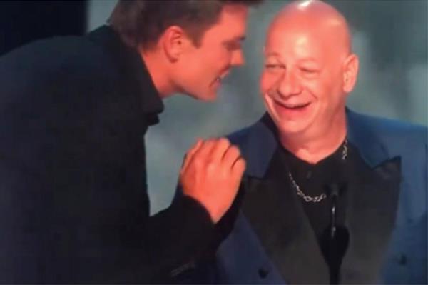 Tom Brady telling Jeff Ross to lay off Robert Kraft. 