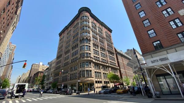 The FBI serving a search warrant at former NYC Mayor Rudy Giuliani's residence, a large building with many windows, at 45 East 66th Street in Manhattan, NY