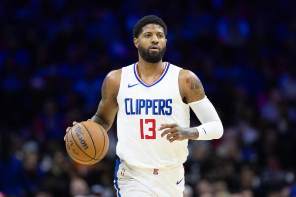 LA Clippers forward Paul George dribbling a basketball against the Philadelphia 76ers during the fourth quarter of a game at Wells Fargo Center