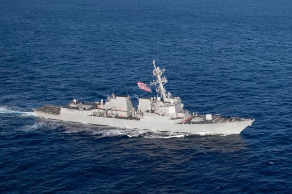 A US Navy warship sails on the seas.