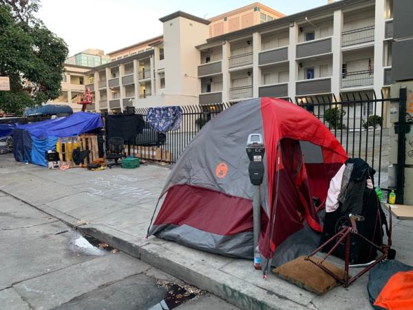A homeless encampment in front of the closed Civic Center Inn on the corner of Ellis and Polk Streets in the Tenderloin District in September 2023.