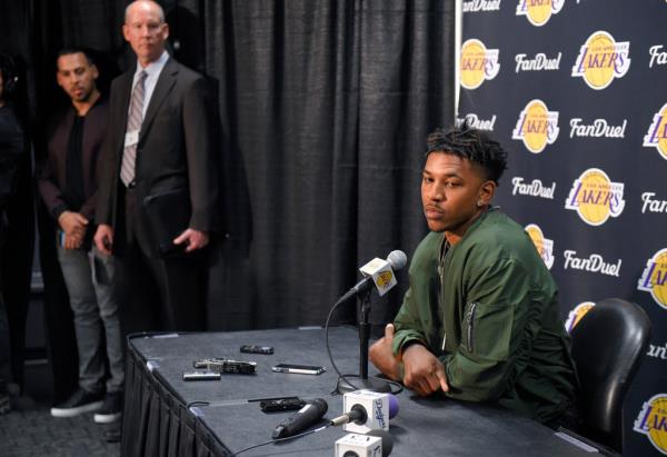 Lakers' Nick Young speaks to the media prior to the team's game against the Miami Heat, March 30, 2016, in Los Angeles.  