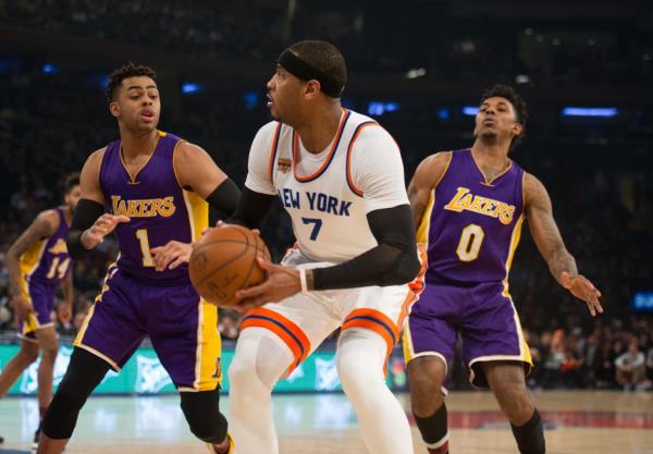 Lakers forward Nick Young (0), right, and D'Angelo Russell defending against the Knicks on Feb. 6, 2017. 