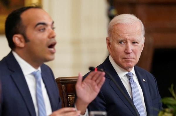Director of the Co<em></em>nsumer Financial Protection Bureau Rohit Chopra and President Biden in 2023.