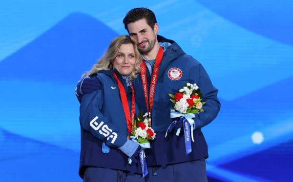 Bro<em></em>nze medalists Madison Hubbell and Zachary Do<em></em>nohue of USA celebrate during the Figure Skating Ice Dance Free Dance medal ceremony on Day 10 of the Beijing 2022 Winter Olympics 