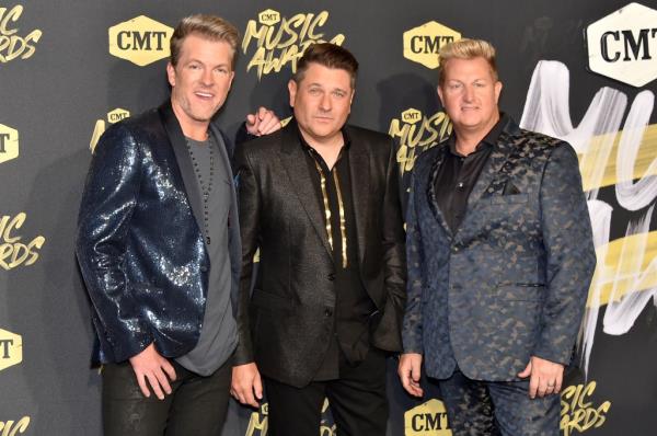 Joe Don Roo<em></em>ney (left), Jay DeMarcus, and Gary LeVox smiling. 