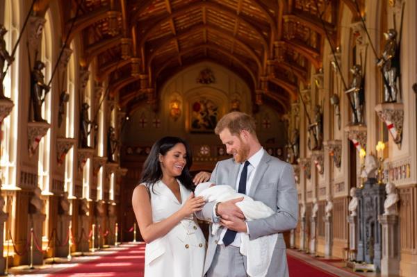 The Duke and Duchess of Sussex with their baby son, Archie Harrison Mountbatten-Windsor, during a photocall in St George's Hall at Windsor Castle on August 5, 2019.