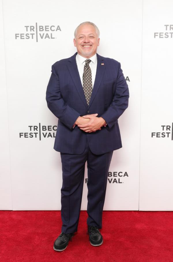 Denver Riggleman in a suit attending the Against All Enemies premiere at the 2023 Tribeca Festival in New York City