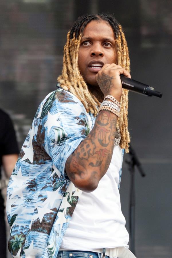 Lil Durk, with long blo<em></em>nde hair, performing on stage at Lollapalooza Music Festival in Grant Park, Chicago