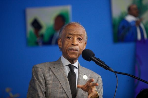 Rev. Al Sharpton in a suit and tie delivering a speech a<em></em>bout the indictment of NYC Mayor Eric Adams at the Natio<em></em>nal Action Network in Manhattan