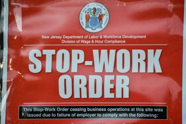 Stop-work order signage on the front of a Boston Market