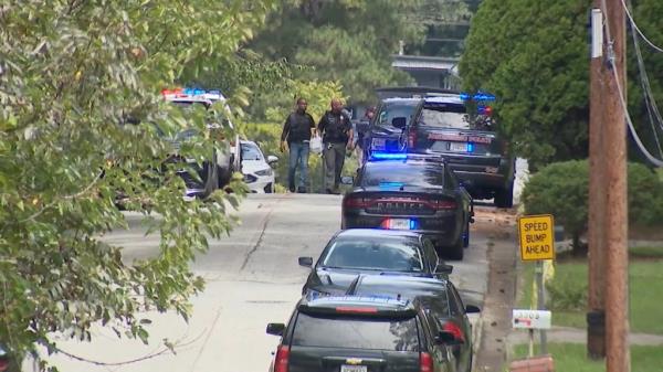 Police are pictured on the scene searching for Ford.