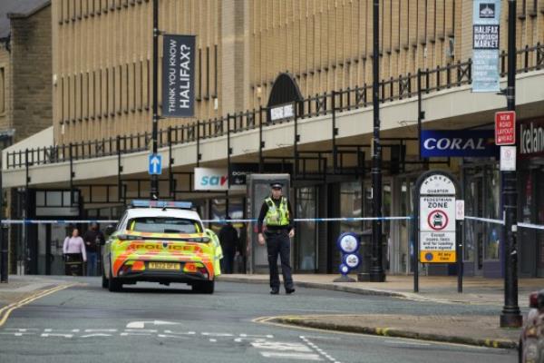 Police in Unio<em></em>n Street, near to the scene of a triple stabbing in Commercial Street in Halifax, West Yorkshire. One man has died and another is fighting for his life after three men were stabbed in the early hours of Sunday morning. Picture date: Sunday October 1, 2023. PA Photo. Officers were called to the incident at 3.48am following reports that three men had been assaulted, West Yorkshire Police said. All three were rushed to hospital with stab wounds wher<em></em>e one of them died shortly after. A second man is in a critical co<em></em>ndition while the third is being treated for non-life threatening injuries. See PA story POLICE Halifax. Photo credit should read: Danny Lawson/PA Wire