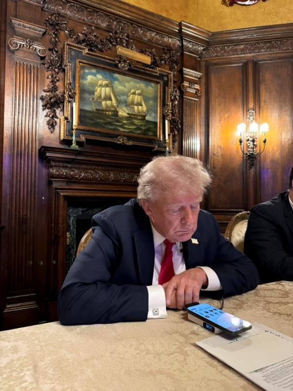 Former U.S. President Do<em></em>nald Trump speaking with Elon Musk during an interview at Mar-a-Lago in Palm Beach, Florida