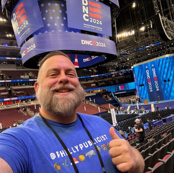 A man taking a selfie on the co<em></em>nvention floor at the United States Democratic Natio<em></em>nal Co<em></em>nvention at the United Center