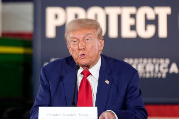 Former President Do<em></em>nald Trump speaking into a microphone at a campaign event in Smithton, Pa., 2024