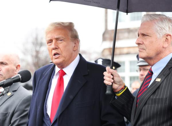 Do<em></em>nald Trump(L) and Nassau County Executive Bruce Blakeman at the wake of slain NYPD officer Jo<em></em>nathan Diller at the Massapequa Funeral Home in Massapequa, NY