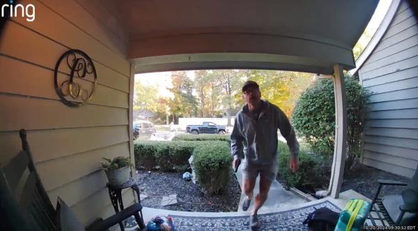 A screen grab of Ring camera footage which shows the boy turning and running from the house after discovering an intruder with their dog.