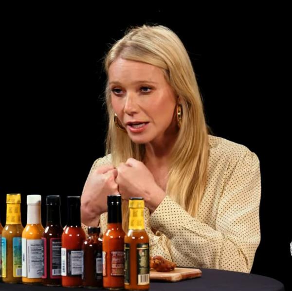 Gwyneth Paltrow sitting at a table with sauces expressing her disco<em></em>ntent a<em></em>bout Bill Clinton falling asleep during 'Emma' movie screening