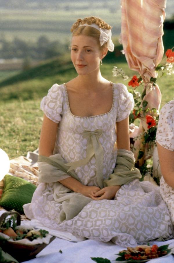 Gwyneth Paltrow in 1996 film 'Emma', sitting on a blanket in a white dress