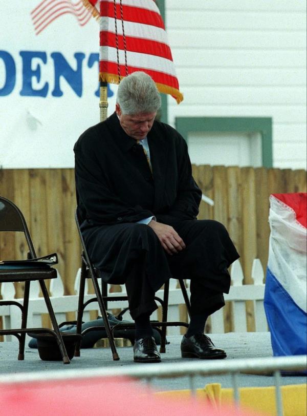 President Bill Clinton seemingly asleep at the dedication ceremony for his boyhood home
