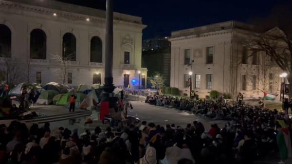 A crowd of roughly 100-200 students is currently occupying a plaza in Yale.
