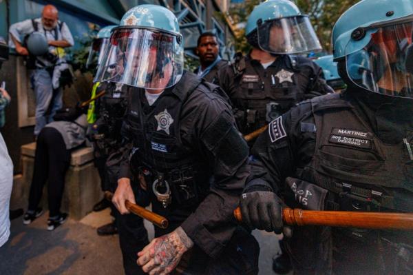 Chicago police officers in riot gear outside of the Israeli consulate.