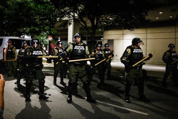 Chicago State Police officers on the street near the consulate.