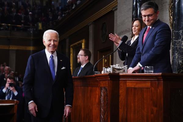 President Joe Biden, from left, looks on with Vice President Kamala Harris and House Speaker Mike Johnson, R-La., before delivering the State of the Unio<em></em>n address to a joint session of Co<em></em>ngress at the Capitol, Thursday, March 7, 2024, in Washington. 