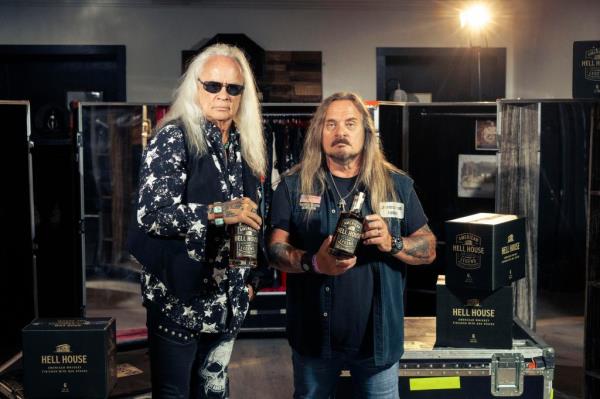Rickey Medlocke and Johnny Van Zant with Hell House whiskey.