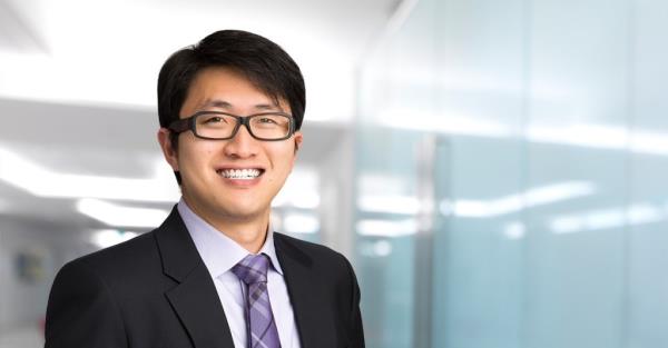 Can Sun, former general counsel of FTX, a man wearing glasses and a suit