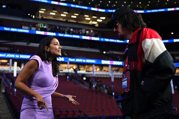 Stephen Colbert speaks with Rep. Alexandria Ocasio-Cortez at the DNC