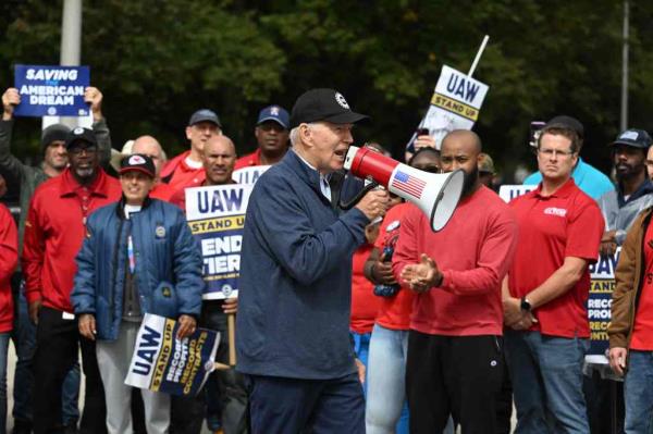 US President Joe Biden addresses striking members of the United Auto Workers (UAW) unio<em></em>n at a picket line outside a General Motors Service Parts Operations plant in Belleville, Michigan.