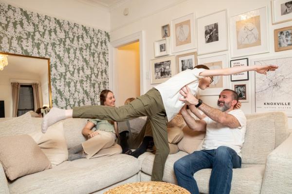 The Miller family havin<em></em>g fun in their living room.