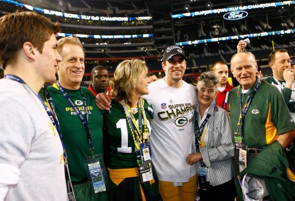 Green Bay Packers quarterback Aaron Rodgers (12) poses with his family, (L-R) his brother Jordan, his father Ed, his mother Darla, his grandmother Barbara Pittman and his grandfather Chuck Pittman after being named the Most Valuable Player in a win over the Pittsburgh Steelers in Super Bowl XLV on Sunday, Feb. 6, 2011, in Arlington, Texas. 