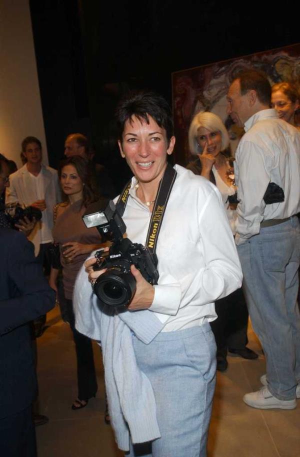 Maxwell taking photos at a party