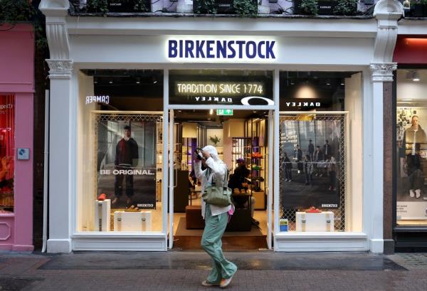 Chi In-jin walking past a Birkenstock shoe store in Lo<em></em>ndon on October 11, 2023.