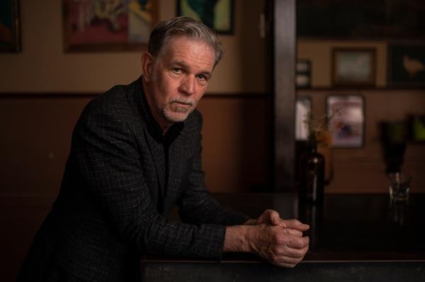 Netflix co-founder and CEO, Reed Hastings, sitting at a table during a meeting with subs<em></em>cription streaming executives in Sydney, 2022