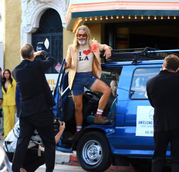 Paul Mescal sitting front row at the Gucci Men's Spring Summer 2025 Fashion Show in Milan, wearing a blue shirt and shorts