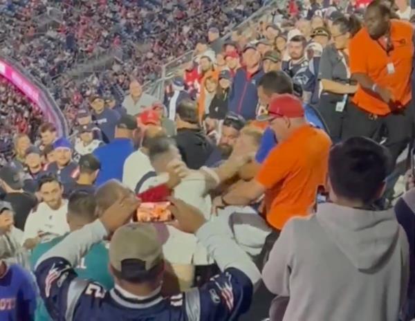 The unidentified Dolphins fan is seen in footage punching Dale Mooney.