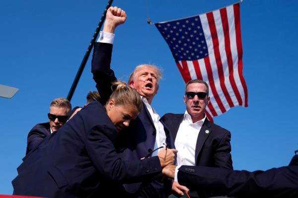 Republican presidential candidate former President Do<em></em>nald Trump is surrounded by U.S. Secret Service agents at a campaign rally, July 13, 2024, in Butler, Pa.