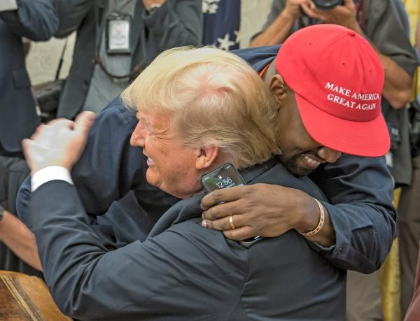 Kanye embracing Do<em></em>nald Trump. 