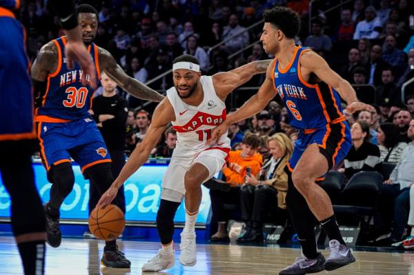 Toro<em></em>nto Raptors forward Bruce Brown (11) drives to the basket against New York Knicks guard Quentin Grimes (6) during the second half of an NBA basketball game in New York, Saturday, Jan. 20, 2024. 