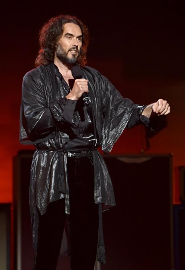 LOS ANGELES, CALIFORNIA - JANUARY 24: Russell Brand speaks o<em></em>nstage during MusiCares Person of the Year ho<em></em>noring Aerosmith at West Hall at Los Angeles Co<em></em>nvention Center on January 24, 2020 in Los Angeles, California. (Photo by Lester Cohen/Getty Images for The Recording Academy ) - 12554815