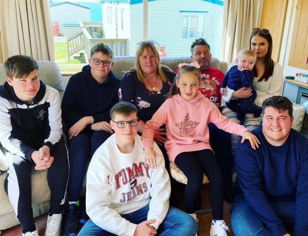 The mom-of-six is seen with her family following the botched op. 